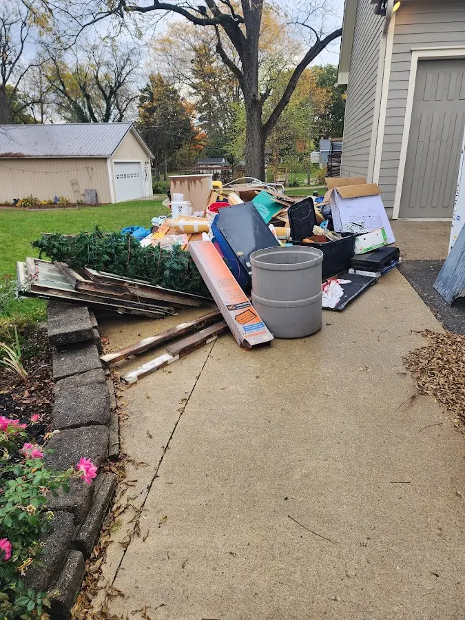 Dumpster being loaded with debris for Commercial Dumpster Rental in Piedmont